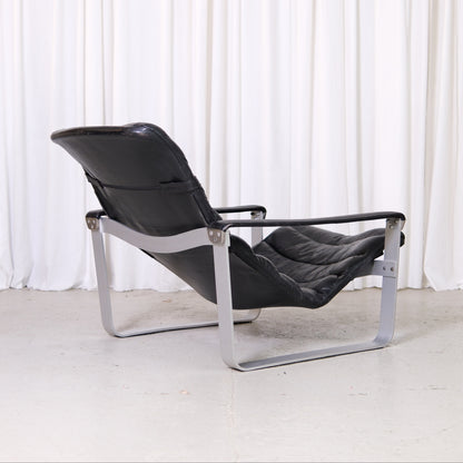 Ilmari Lappalainen Pulkka Lounge Chair and Ottoman in Black Leather, Asko Export