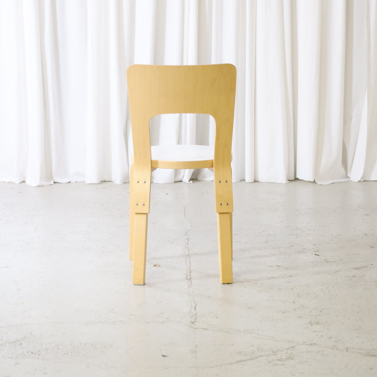 Artek Chair 66 in birch with white laminate seat, rear view