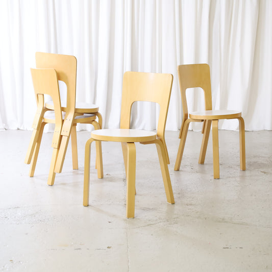 Set of four Artek Chair 66 chairs in birch with white laminate seats