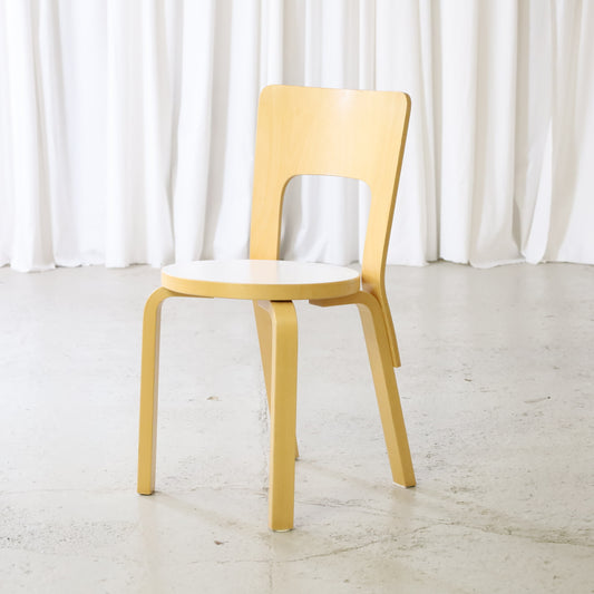 Artek Chair 66 in birch with white laminate seat, front angled view