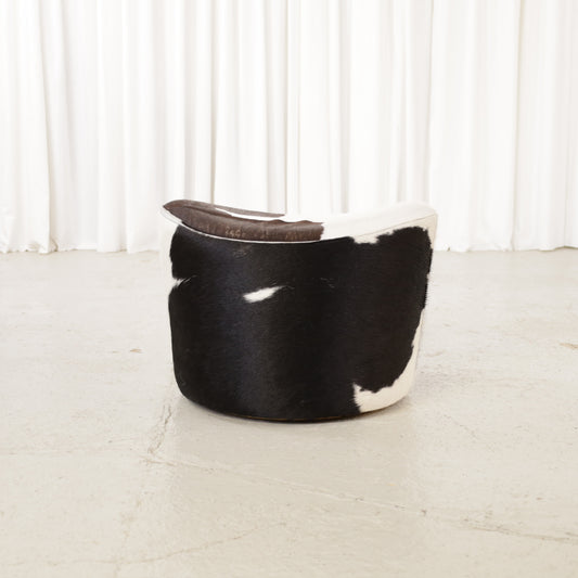 Niels Gammelgaard IKEA Stockholm cowhide swivel ottoman – Opposite angled view