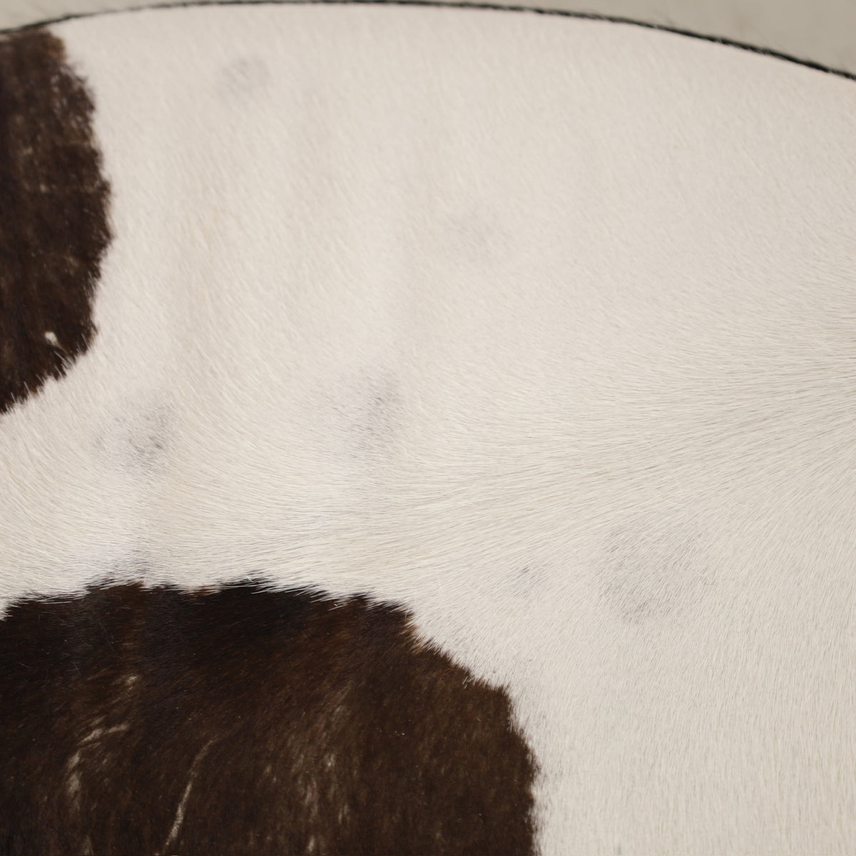 Niels Gammelgaard IKEA Stockholm cowhide swivel ottoman – Cowhide seat surface detail