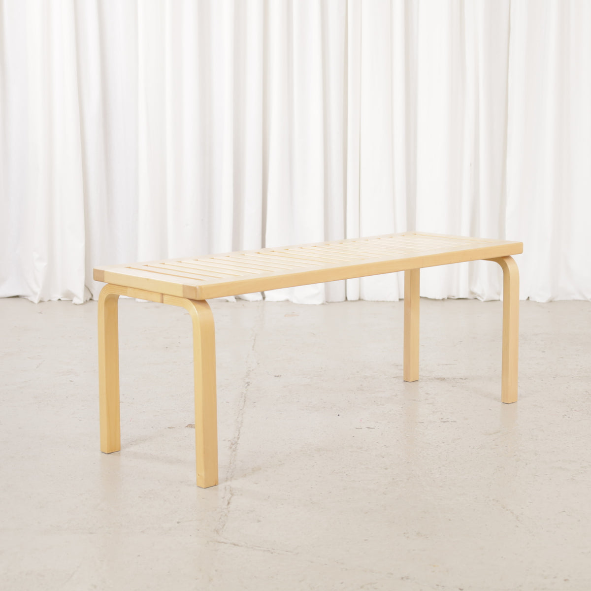 Alvar Aalto Artek 153A birch bench – Front angled view