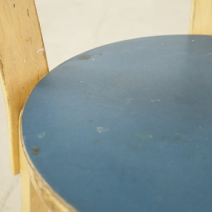 Blue linoleum seat with age-related marks