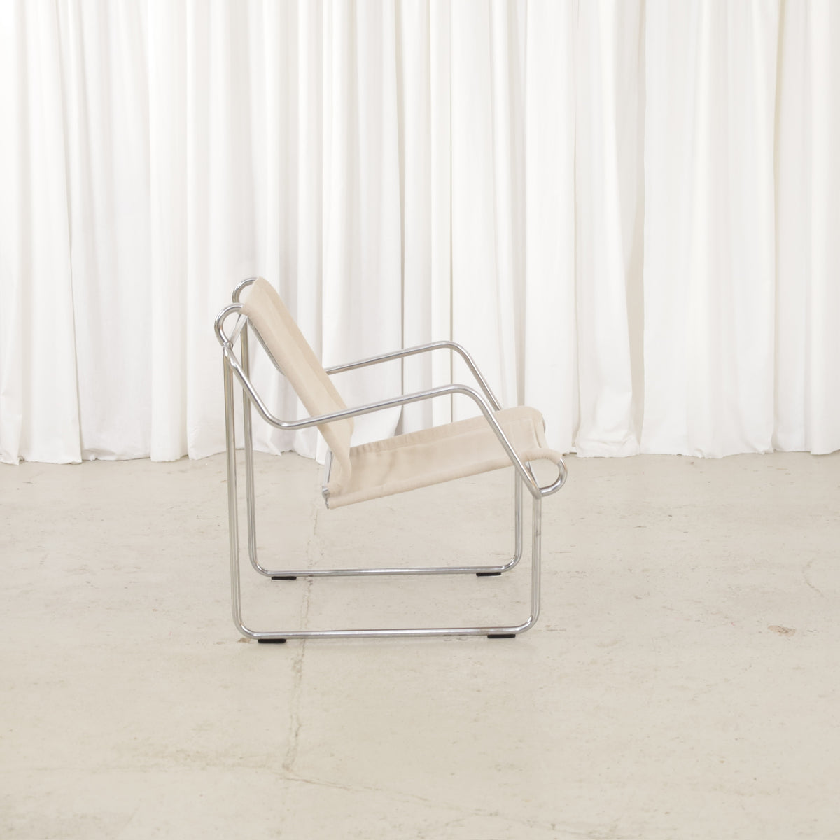 Yrjö Kukkapuro Pressu armchair by Avarte with light linen upholstery and a chrome frame