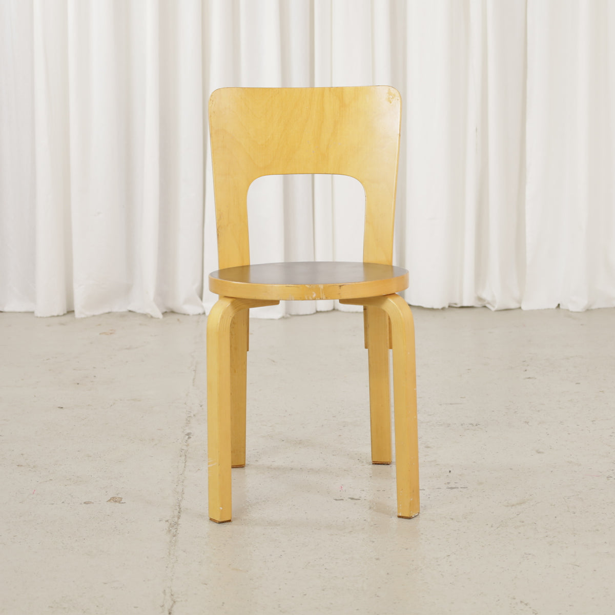 Alvar Aalto Artek Chair 66 with black linoleum seat, front view