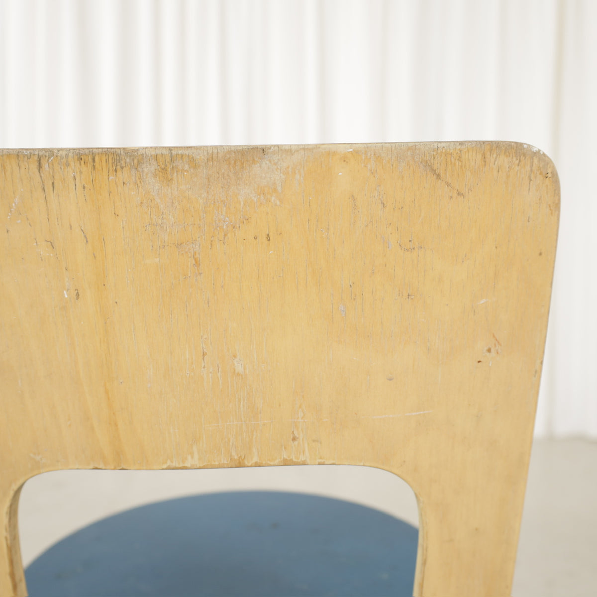 Chair 66 worn backrest finish close-up