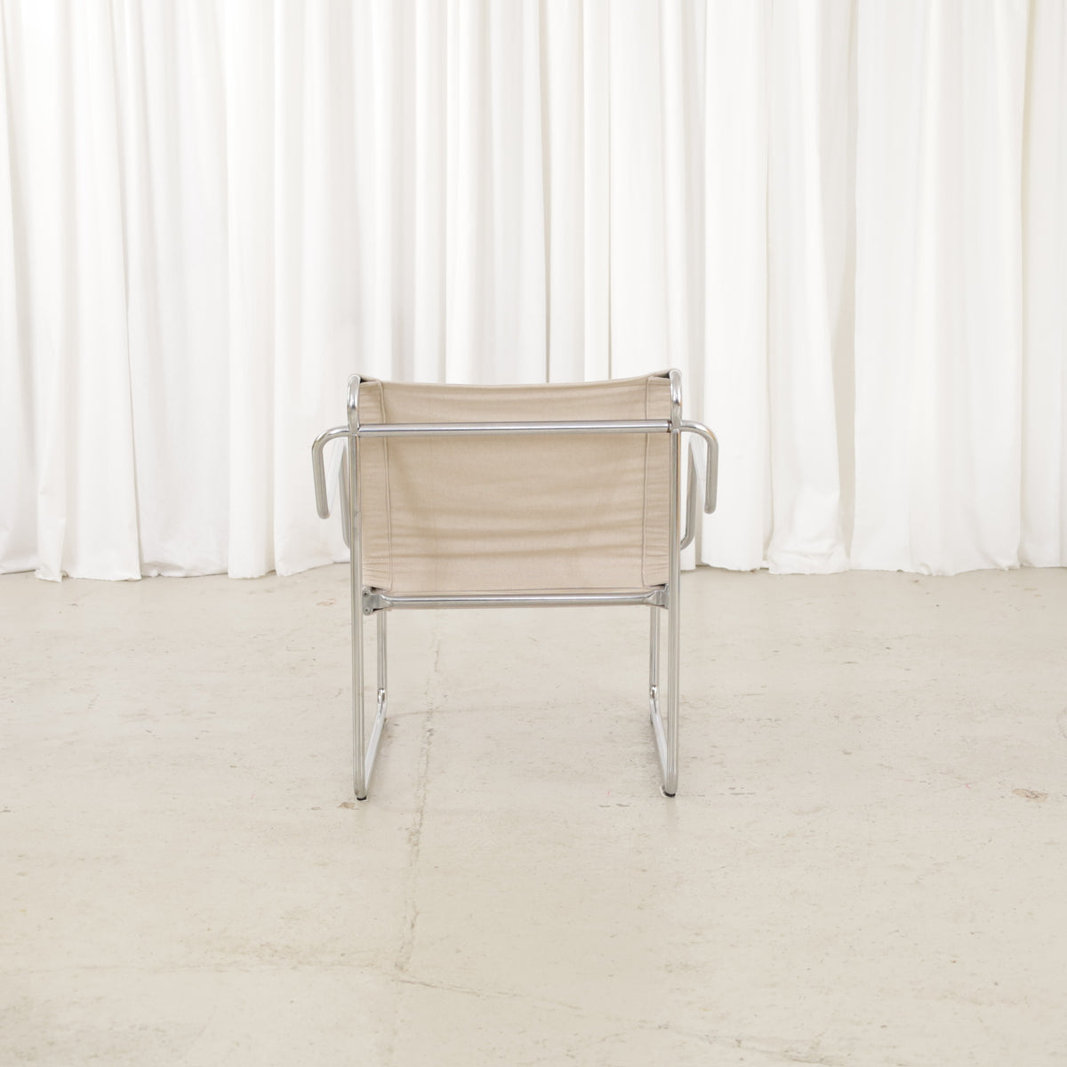 Yrjö Kukkapuro Pressu armchair by Avarte with light linen upholstery and a chrome frame