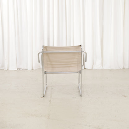 Yrjö Kukkapuro Pressu armchair by Avarte with light linen upholstery and a chrome frame