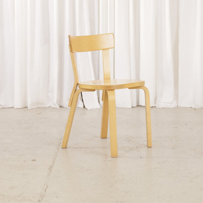 Artek Chair 69 in warm patinated birch, angled front view