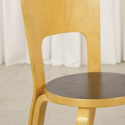 Chair 66 black linoleum seat and birch frame detail