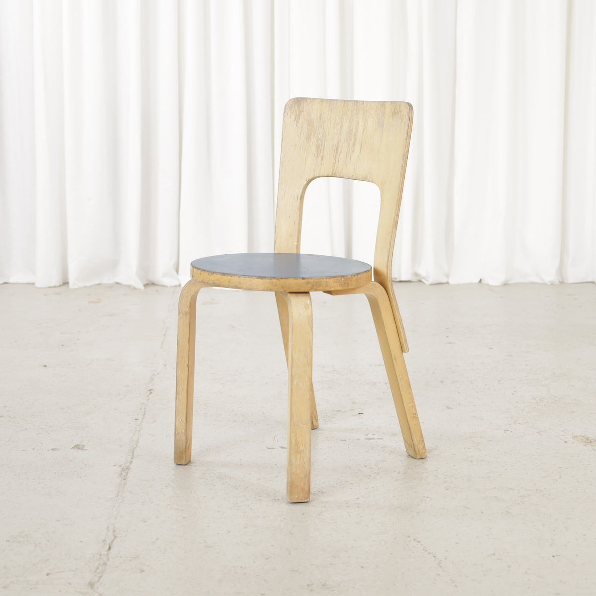 Patinated Artek Chair 66, front angled view
