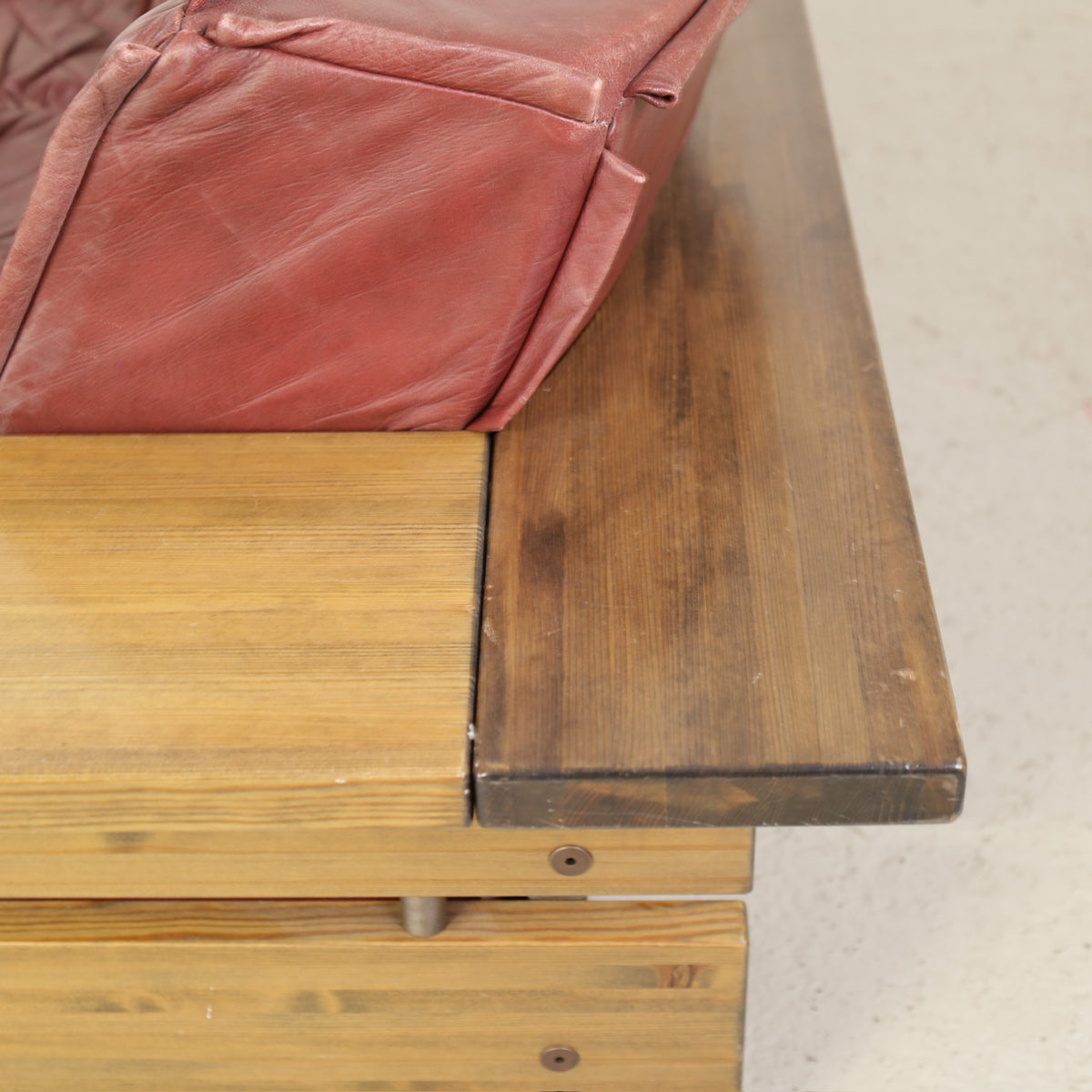 Pinus sofa wood surface and leather upholstery close-up