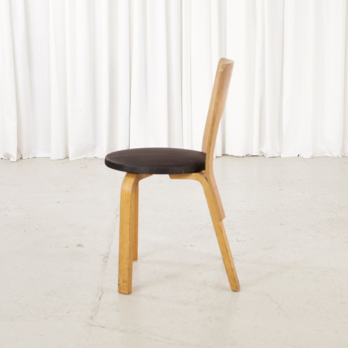 Ash Chair 66 with padded fabric seat, side view