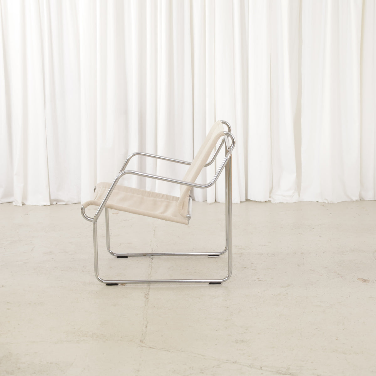 Yrjö Kukkapuro Pressu armchair by Avarte with light linen upholstery and a chrome frame