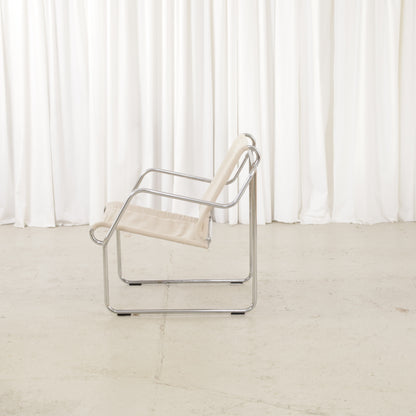 Yrjö Kukkapuro Pressu armchair by Avarte with light linen upholstery and a chrome frame