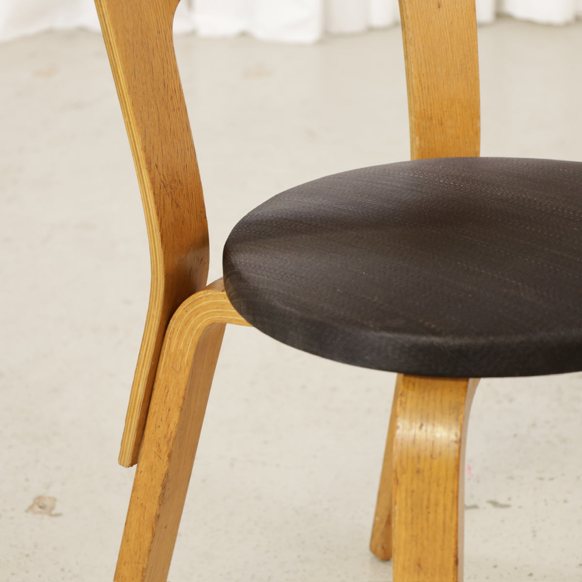 Chair 66 dark fabric seat and ash frame detail