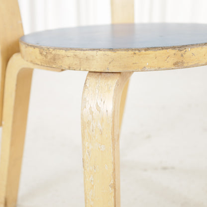 Chair 66 worn finish on bent leg and seat edge