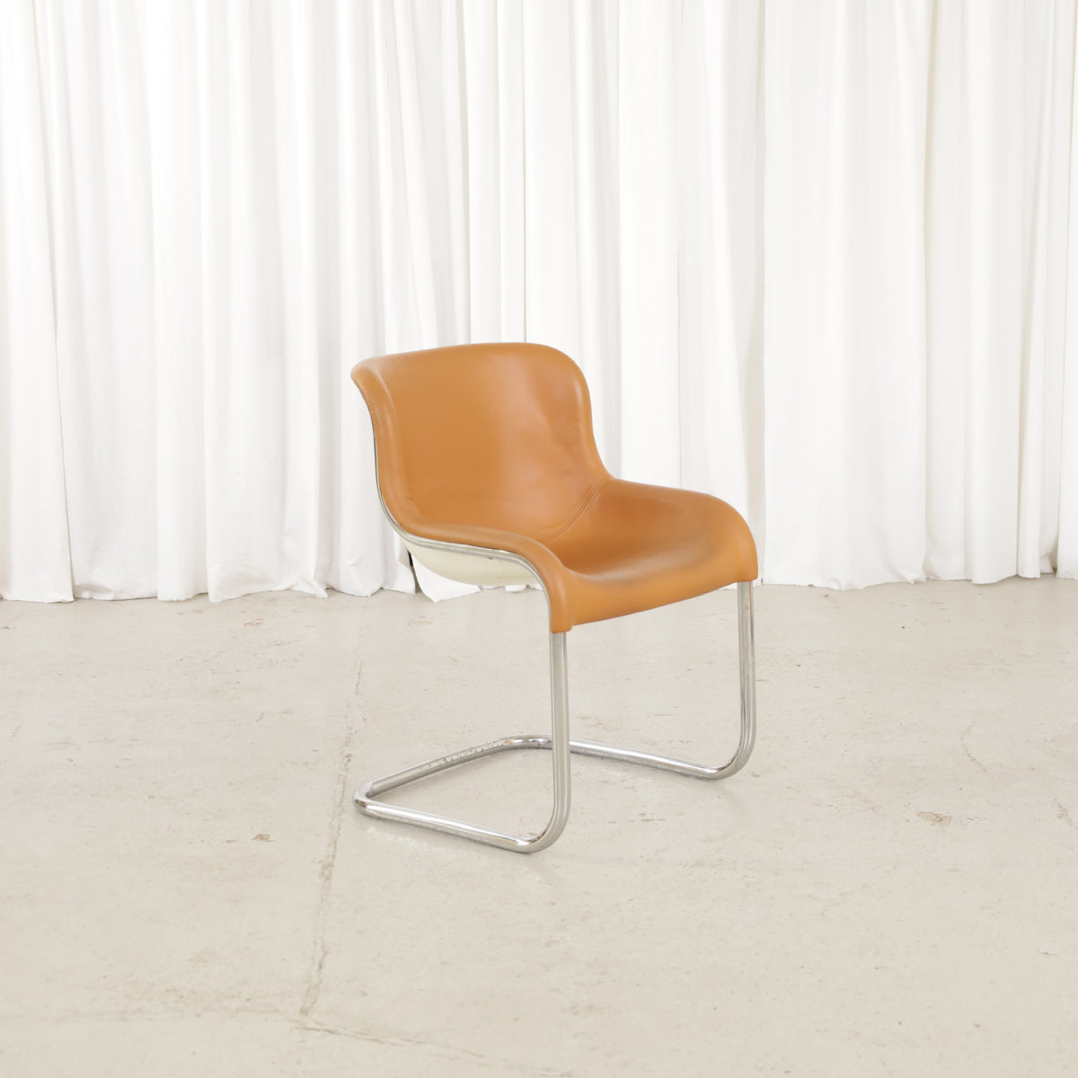 Esko Pajamies Elefantti chair in cognac leather, front three-quarter view