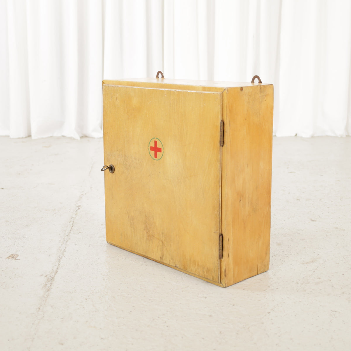 Aino Aalto medicine cabinet in lacquered birch, front angled view