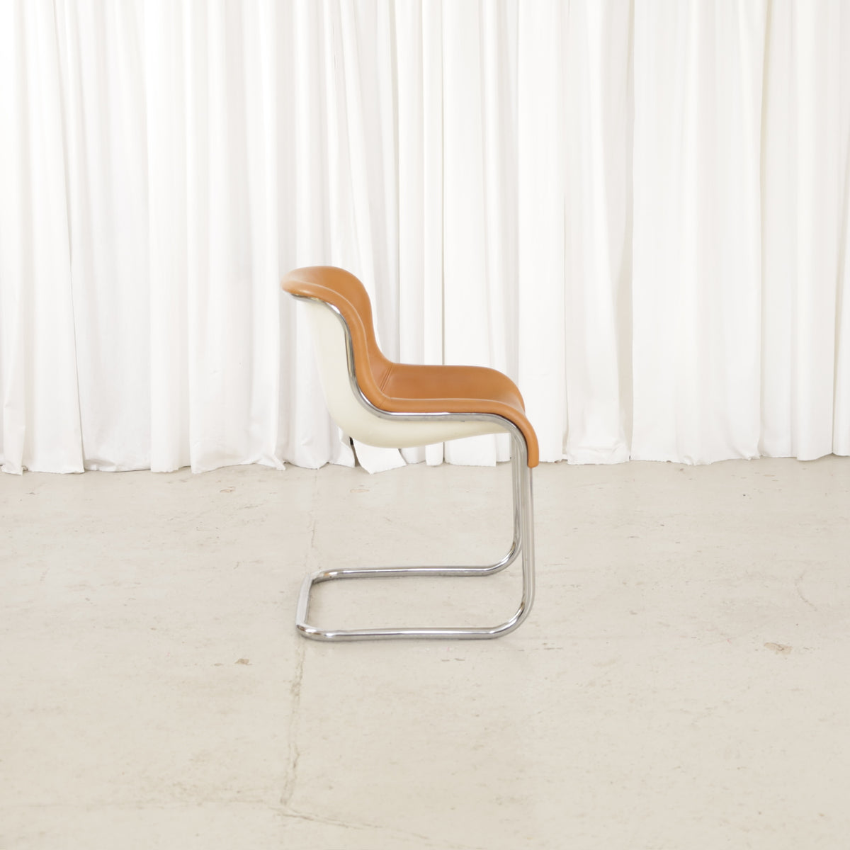 Elefantti chair in cognac leather, left side view