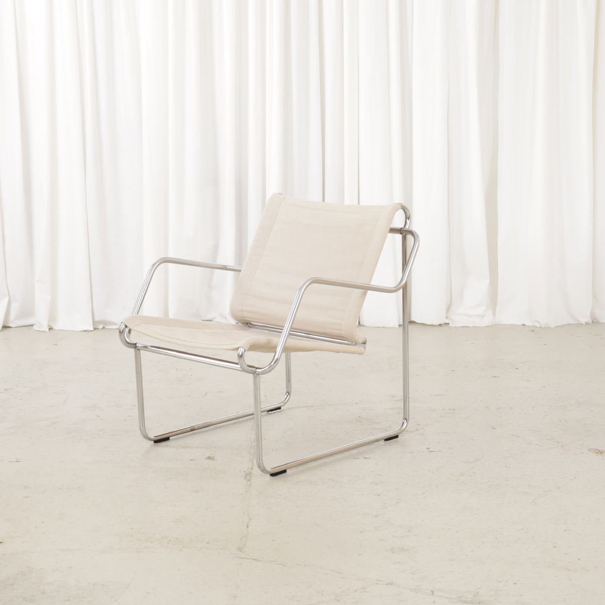 Yrjö Kukkapuro Pressu armchair by Avarte with light linen upholstery and a chrome frame