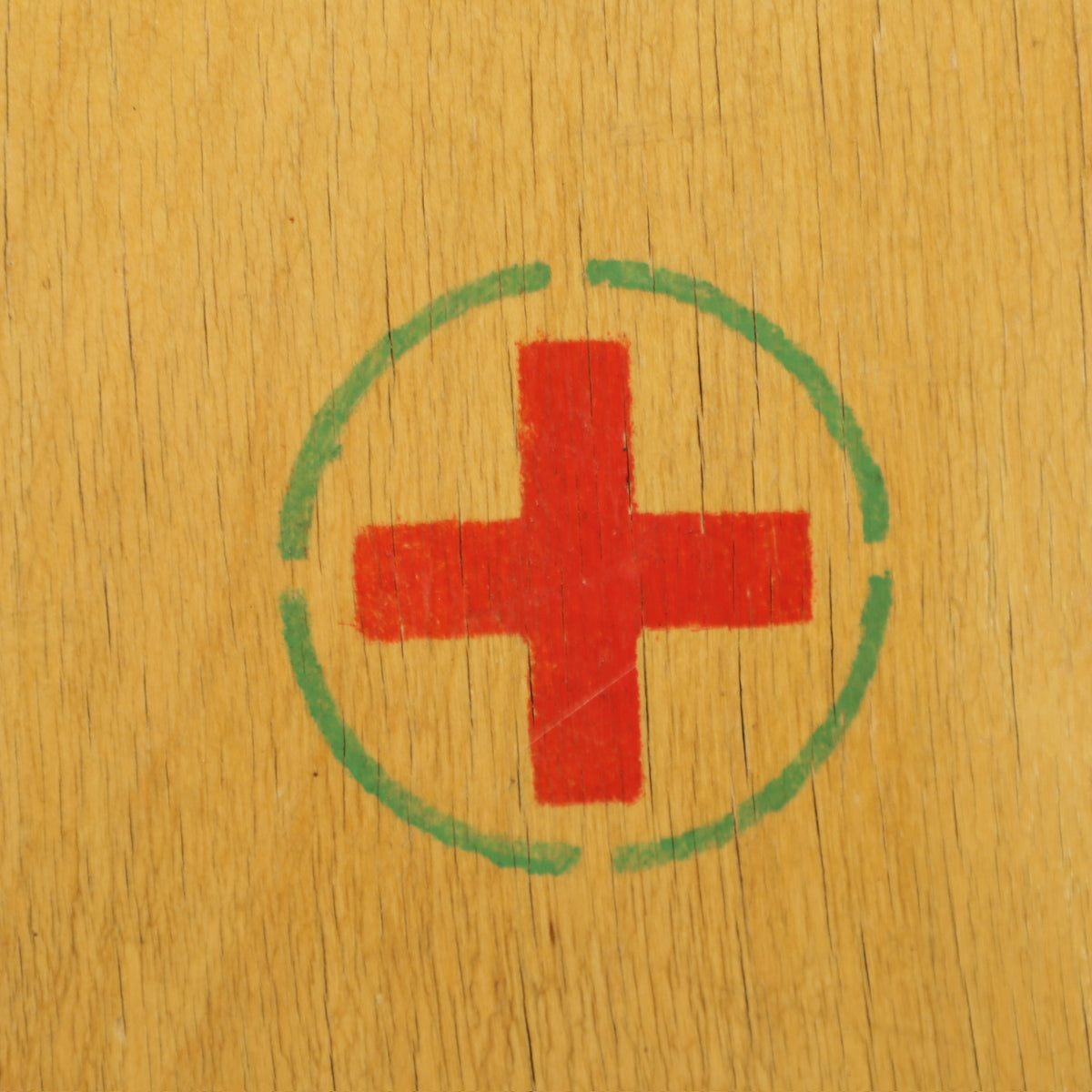 Red cross emblem on medicine cabinet door