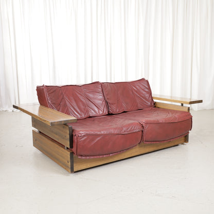 Mattias Ingman Pinus two-seater sofa in reddish-brown leather and pine, front angled view
