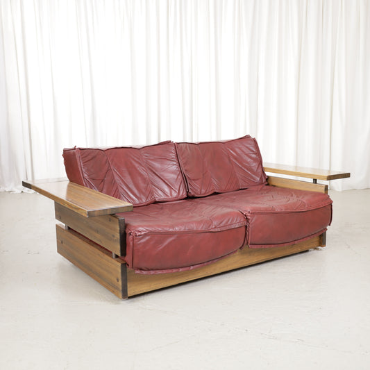 Mattias Ingman Pinus two-seater sofa in reddish-brown leather and pine, front angled view