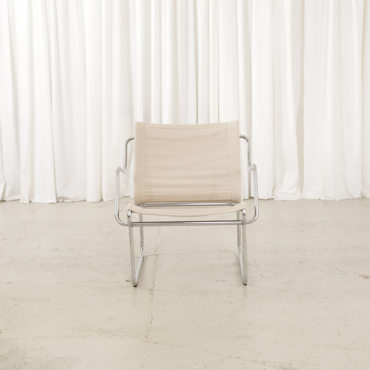 Yrjö Kukkapuro Pressu armchair by Avarte with light linen upholstery and a chrome frame