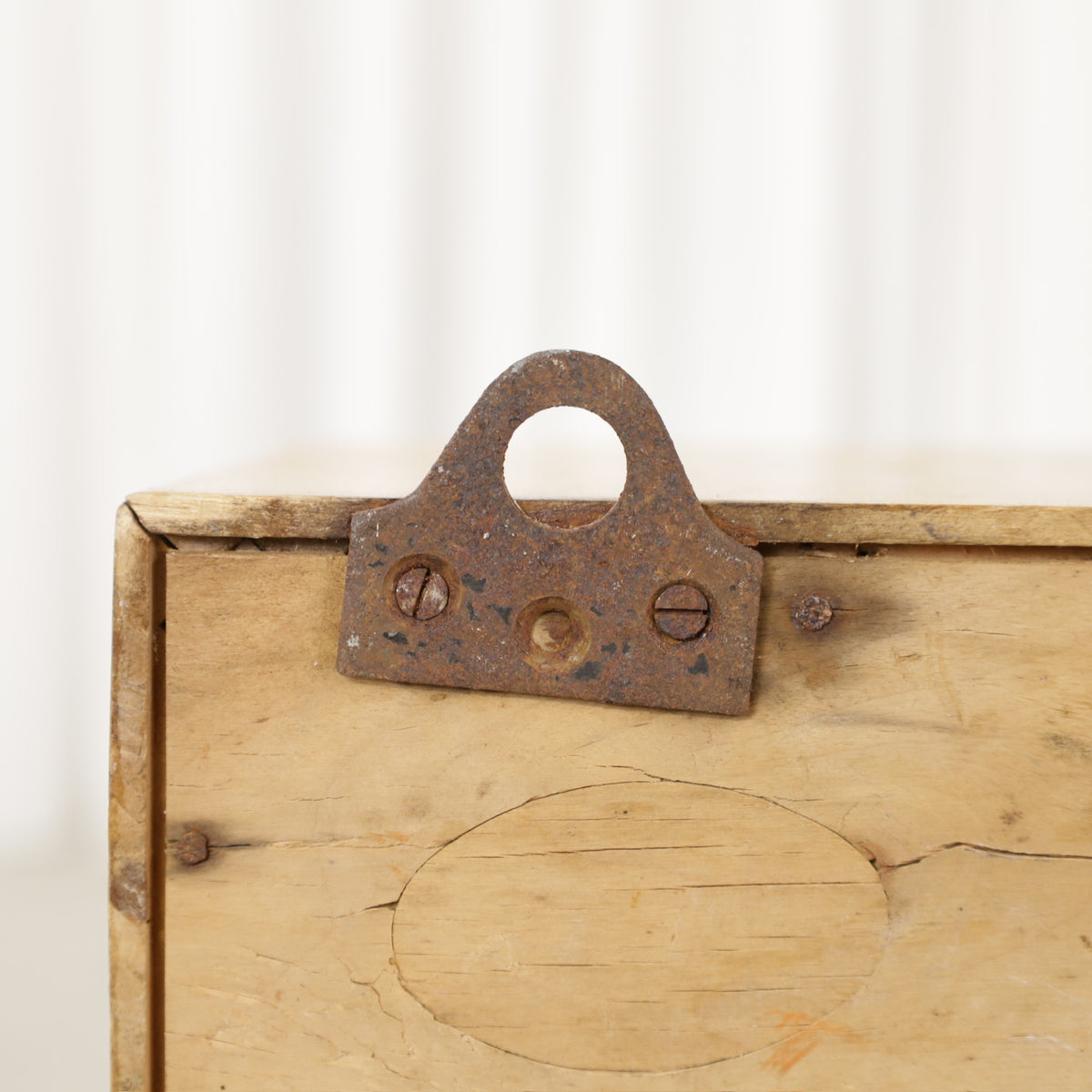 Medicine cabinet rear hanging bracket with rust and wood cracking