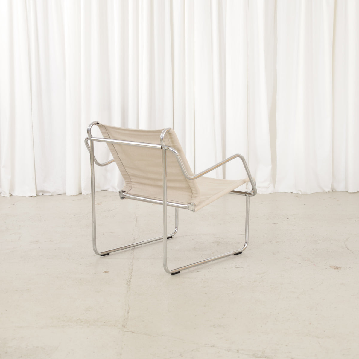 Yrjö Kukkapuro Pressu armchair by Avarte with light linen upholstery and a chrome frame