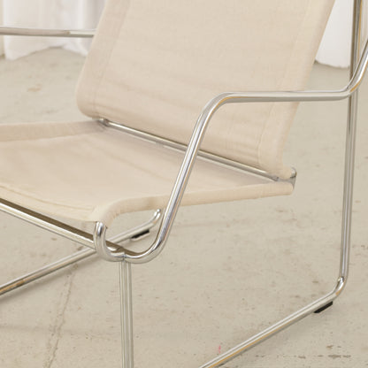 Yrjö Kukkapuro Pressu armchair by Avarte with light linen upholstery and a chrome frame
