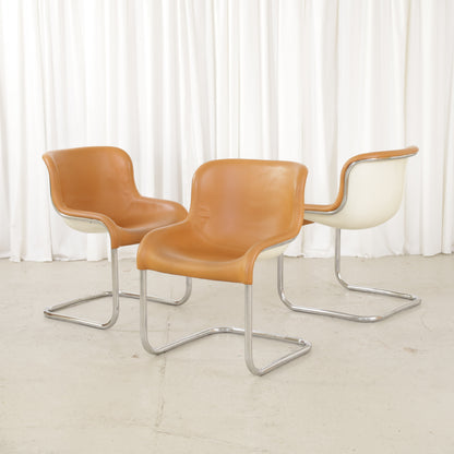 Three Asko Elefantti chairs with cognac leather upholstery and cream shells