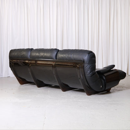 Rear view of three-seat Marsala sofa and curved acrylic shell