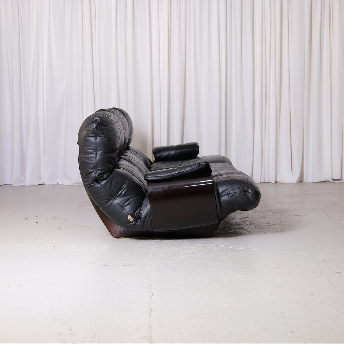 Side view of Marsala sofa with smoked acrylic shell