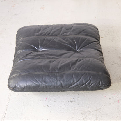 Matching Marsala ottoman with buttoned black leather cushion
