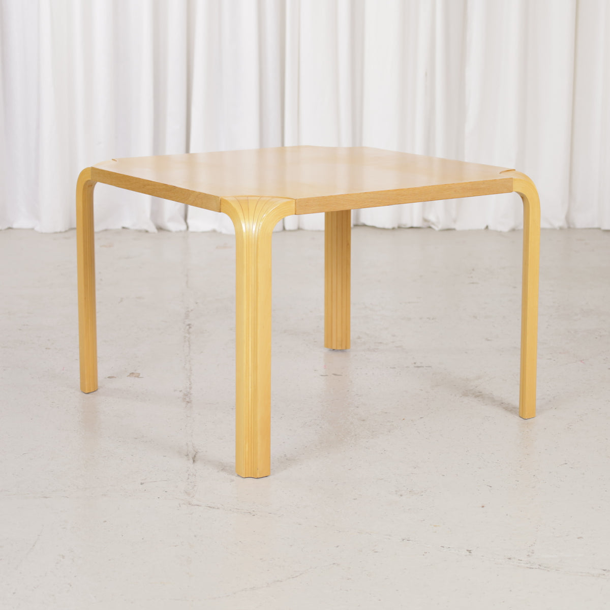 Artek Alvar Aalto X800C fan-leg coffee table, three-quarter view