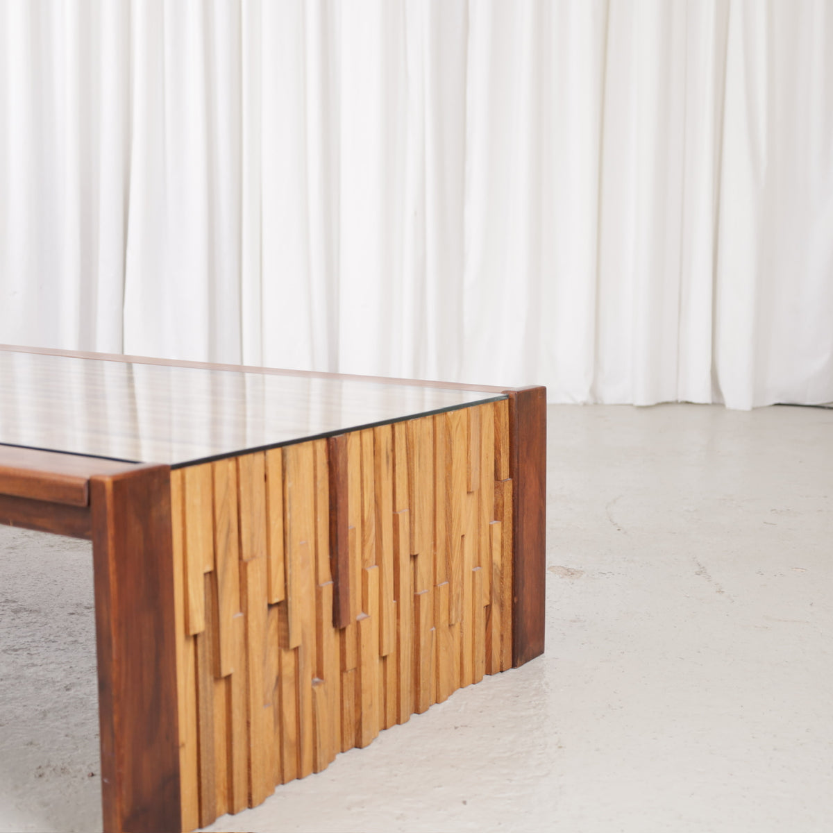 Mixed-wood mosaic end panel and glass tabletop