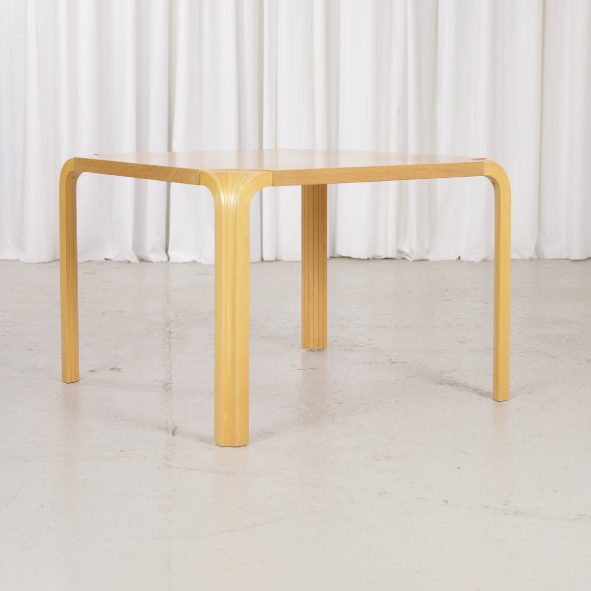 Artek Alvar Aalto X800C fan-leg coffee table, low front view