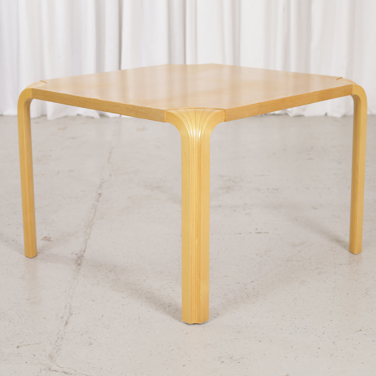 Artek Alvar Aalto X800C fan-leg coffee table, three-quarter view from the opposite side