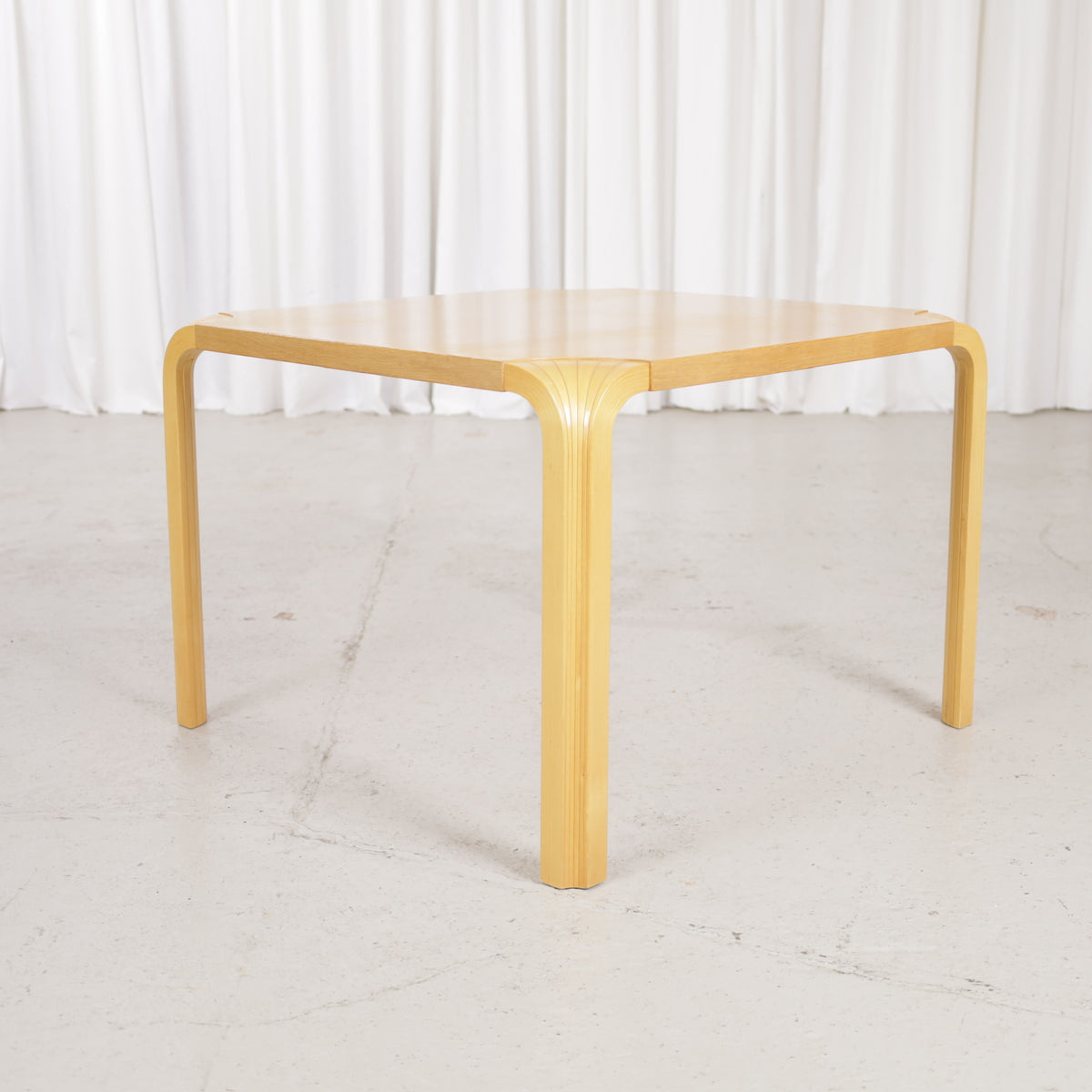 Artek Alvar Aalto X800C fan-leg coffee table, low three-quarter view