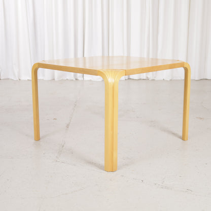 Artek Alvar Aalto X800C fan-leg coffee table, low three-quarter view