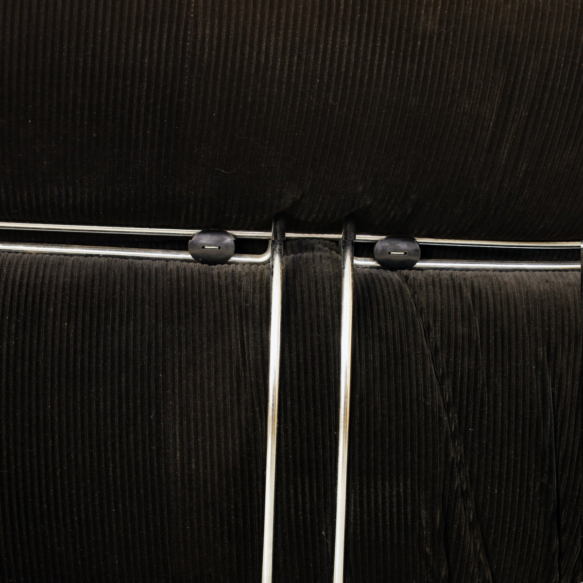 Cassina Soriana sofa in black corduroy – chrome frame close-up