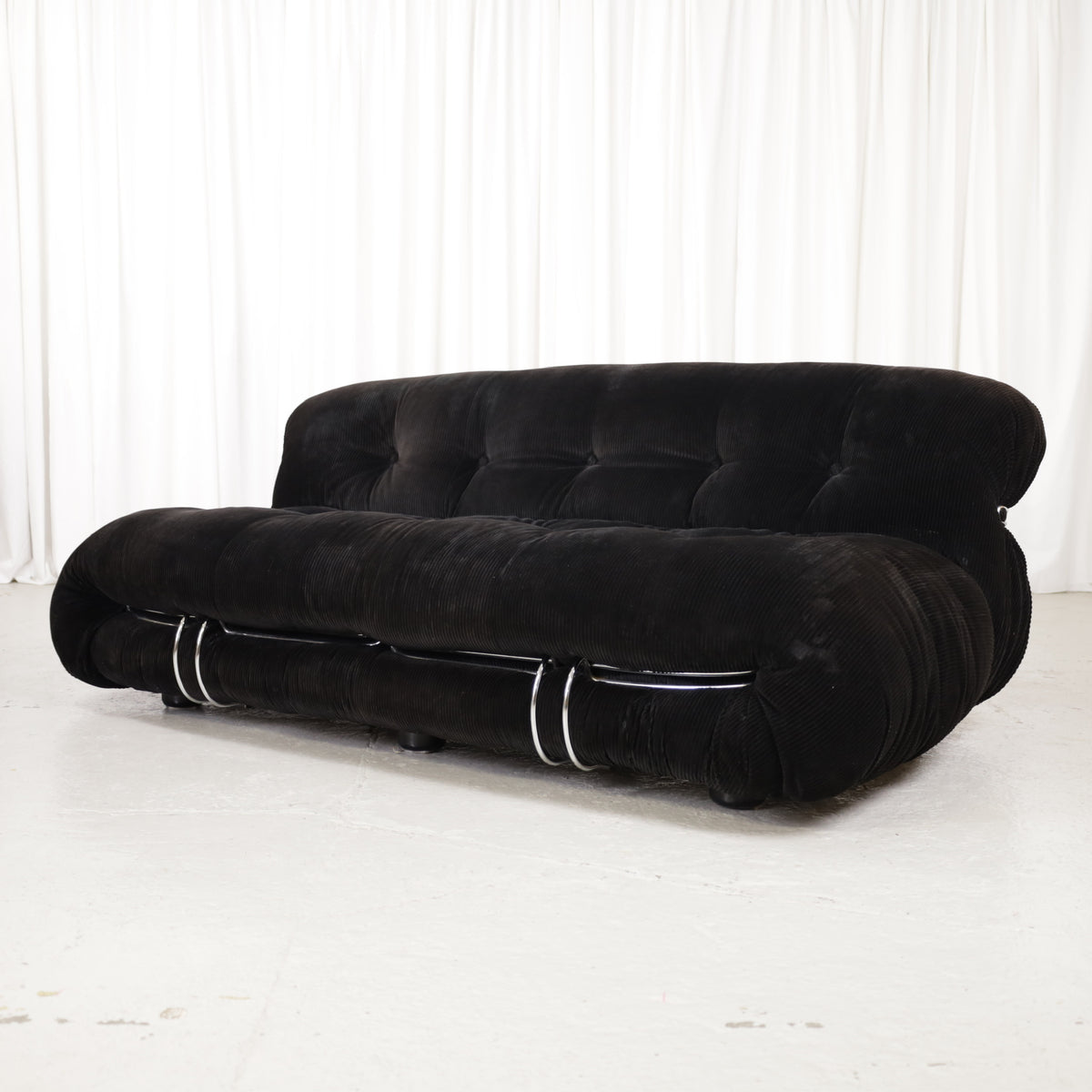 Cassina Soriana sofa in black corduroy – opposite front angle