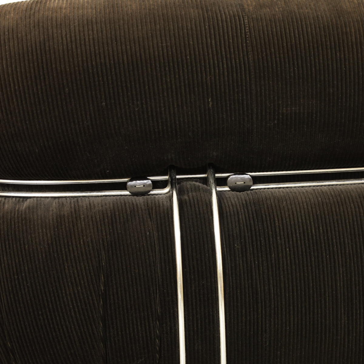Cassina Soriana sofa in black corduroy – chrome clamp detail
