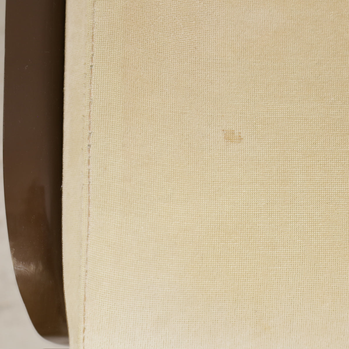 Yrjö Kukkapuro 3814-1KF chair, brown shell and pale yellow upholstery – small stain on seat cushion