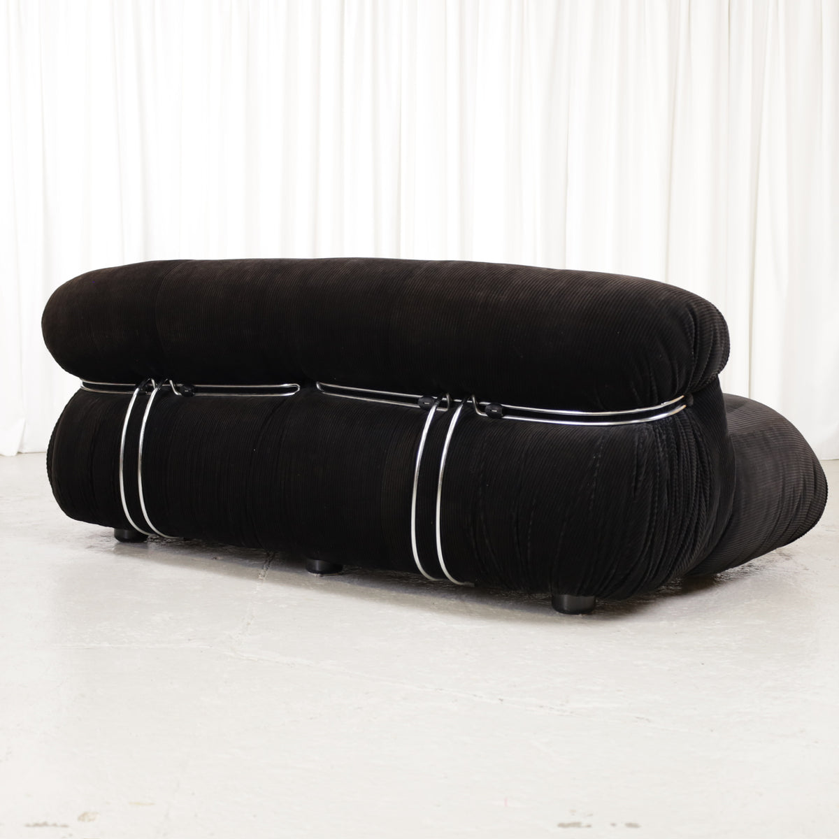 Cassina Soriana sofa in black corduroy – opposite rear angle