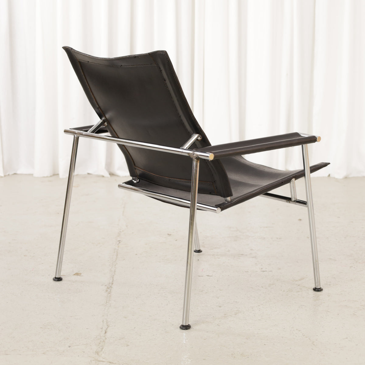 Yrjö Kukkapuro Casino lounge chair in black leather – opposite rear angle