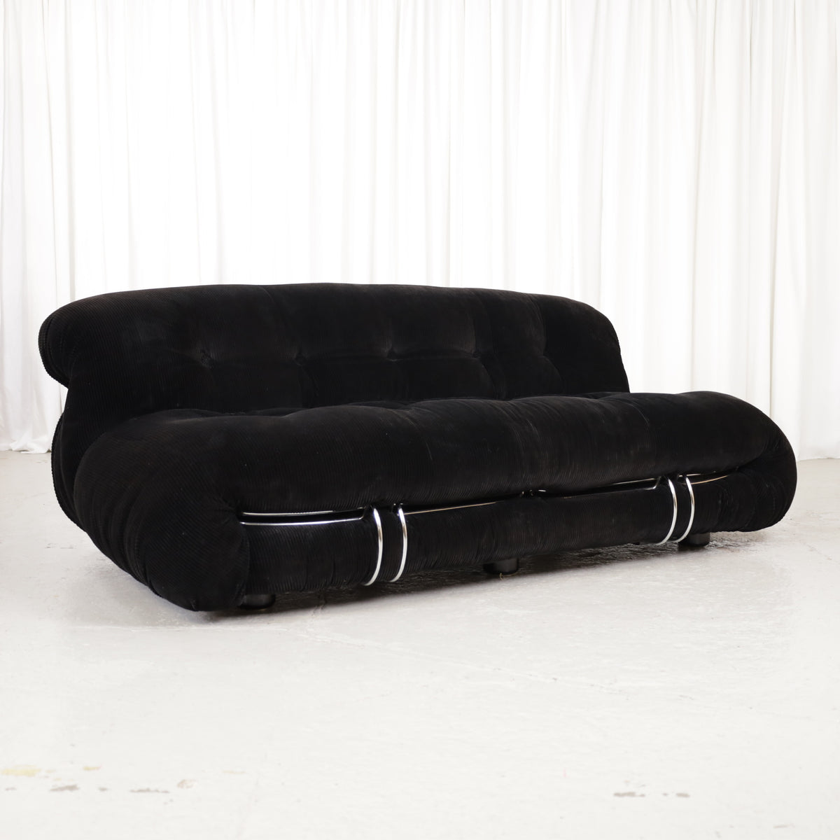Cassina Soriana sofa in black corduroy – three-quarter front view